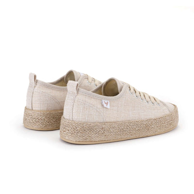 Beige linen lace-up espadrille sneakers with jute platform and rubber sole, showcasing Mediterranean summer style and comfort.