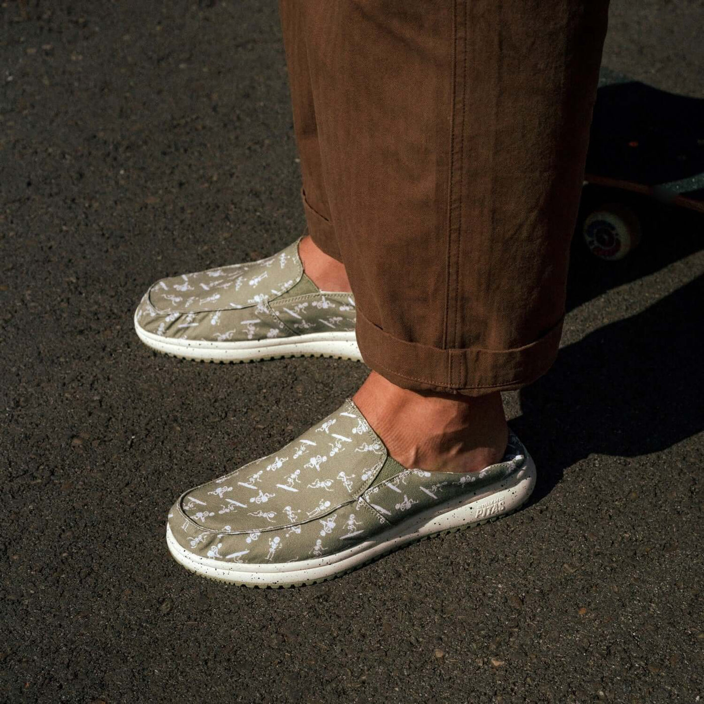 Person wearing Bones Ultralight Loafers with kick-down heels and non-slip outsoles, showcasing the bone design and comfortable EVA sole.