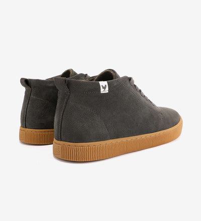 Dark gray Hiro Chukka Boots by Pitas with suede uppers and natural rubber soles, showcasing rear view on a light background.