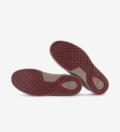 Red rubber soles of Kume Sneakers by Pitas, showcasing grip and durability.