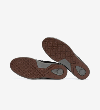 Bottom view of Omi by Pitas casual shoes showing textured rubber soles for grip and durability.