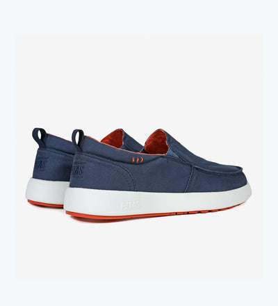 Navy Ischia Hi-Grip loafers with white EVA sole and red rubber outsole, featuring heel pulls and elasticated gussets for comfort.