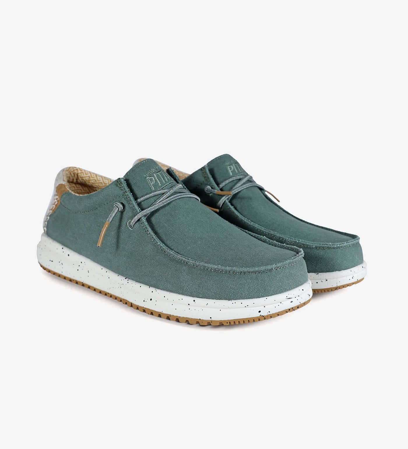 Nias Ultralight Wally boat shoes with easy-on elastic laces, cotton upper, and EVA sole, in green with color contrast rubber outsole.