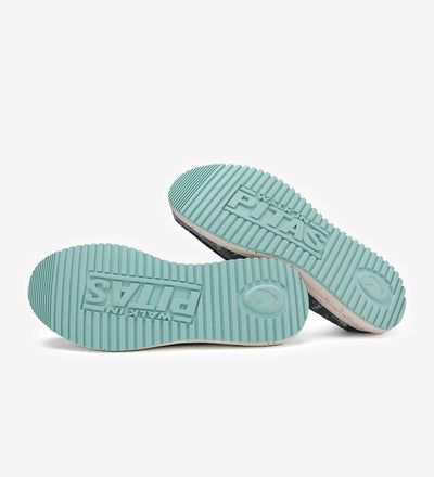 Mint green non-slip rubber outsoles of Bones Ultralight Loafers showing brand logo and grip texture.