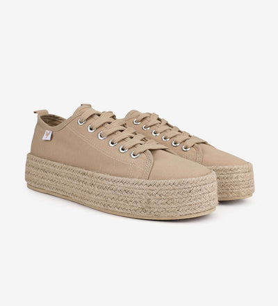 Beige lace-up platform espadrille sneakers with jute band and rubber sole, perfect for a stylish Mediterranean summer look.