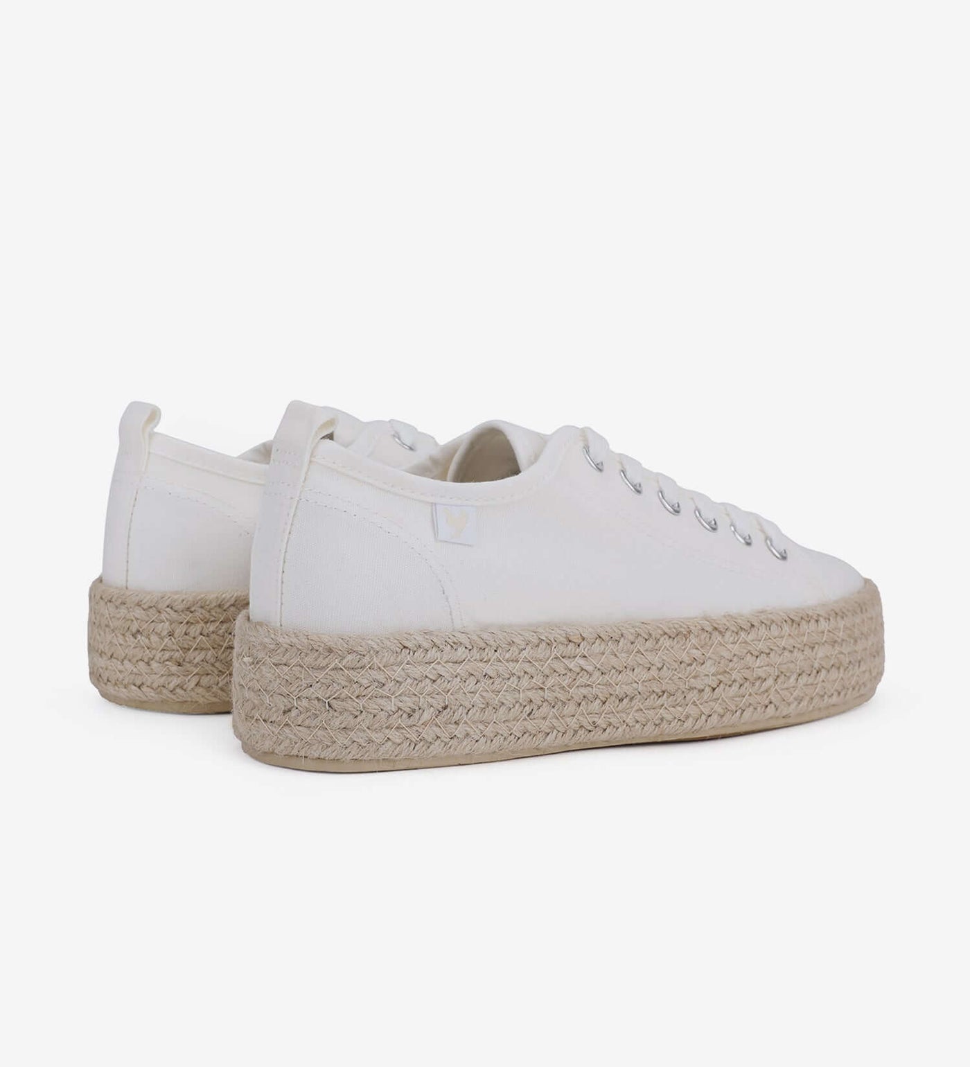 White canvas lace-up espadrille sneakers with a 4cm jute platform sole, showcasing a Mediterranean summer style.