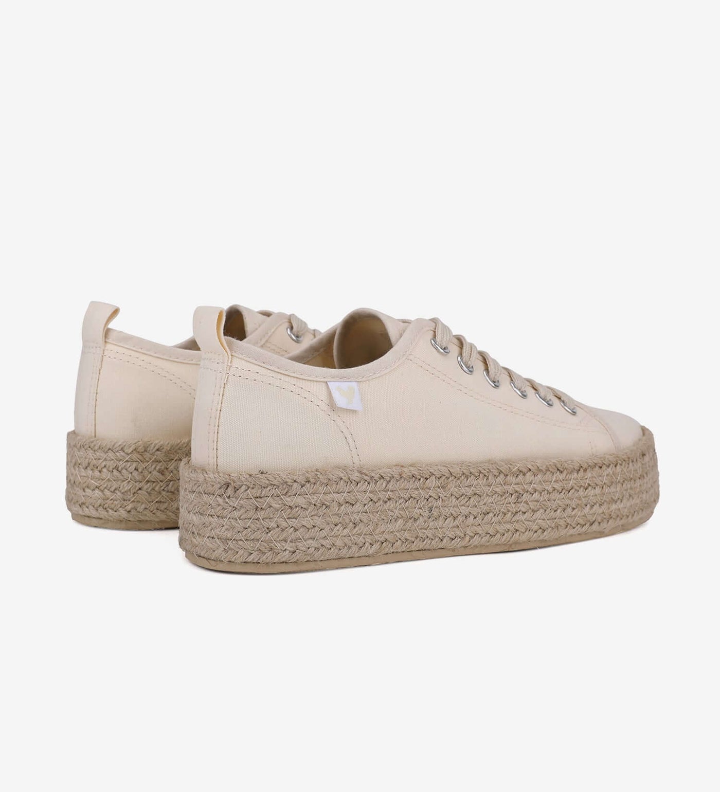 Cream lace-up espadrille sneakers with 4cm jute platform, featuring a durable linen upper and rubber sole for vibrant summer style.