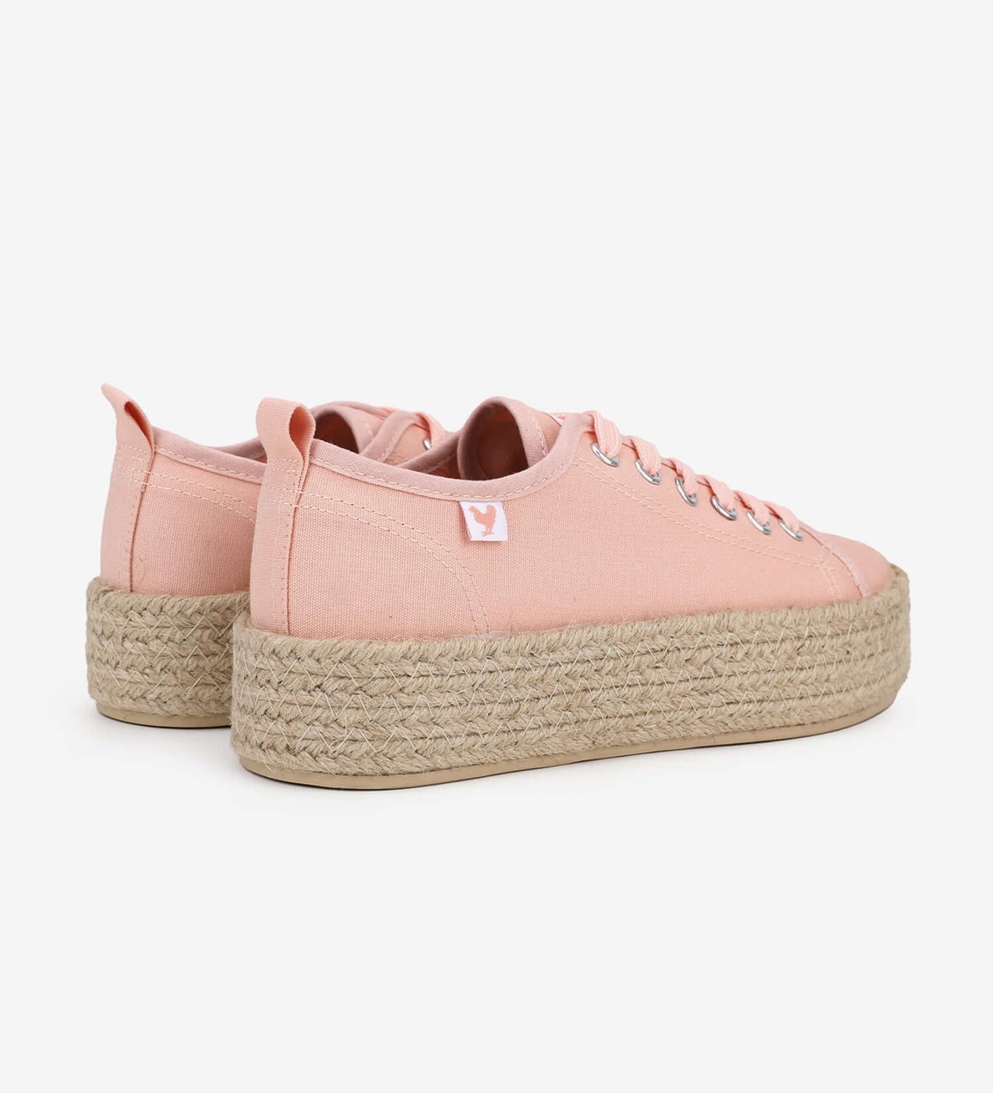 Pink lace-up espadrille sneakers with 4cm jute platform and linen fabric, showcasing a vibrant Mediterranean summer style.