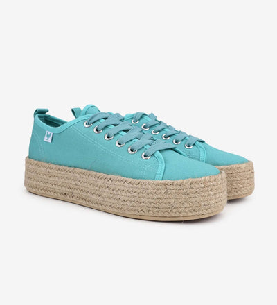 Turquoise lace-up espadrille sneakers with jute platform and rubber sole, showcasing Mediterranean summer style and comfort.