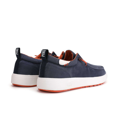 Biarritz Hi-Grip Wally shoes with navy cotton canvas upper, orange laces, and high-grip rubber outsole for men's casual footwear.