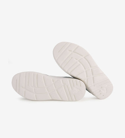 White rubber soles of Zan Leather Sneakers by Pitas, showcasing tread design and durability.