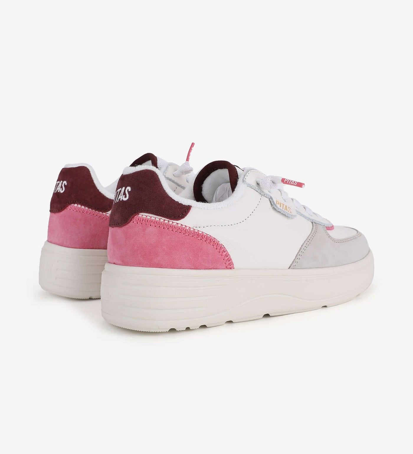 Zan Leather Sneakers by Pitas with pink accents, featuring a 4cm platform and easy-on laces, designed for comfort and style.