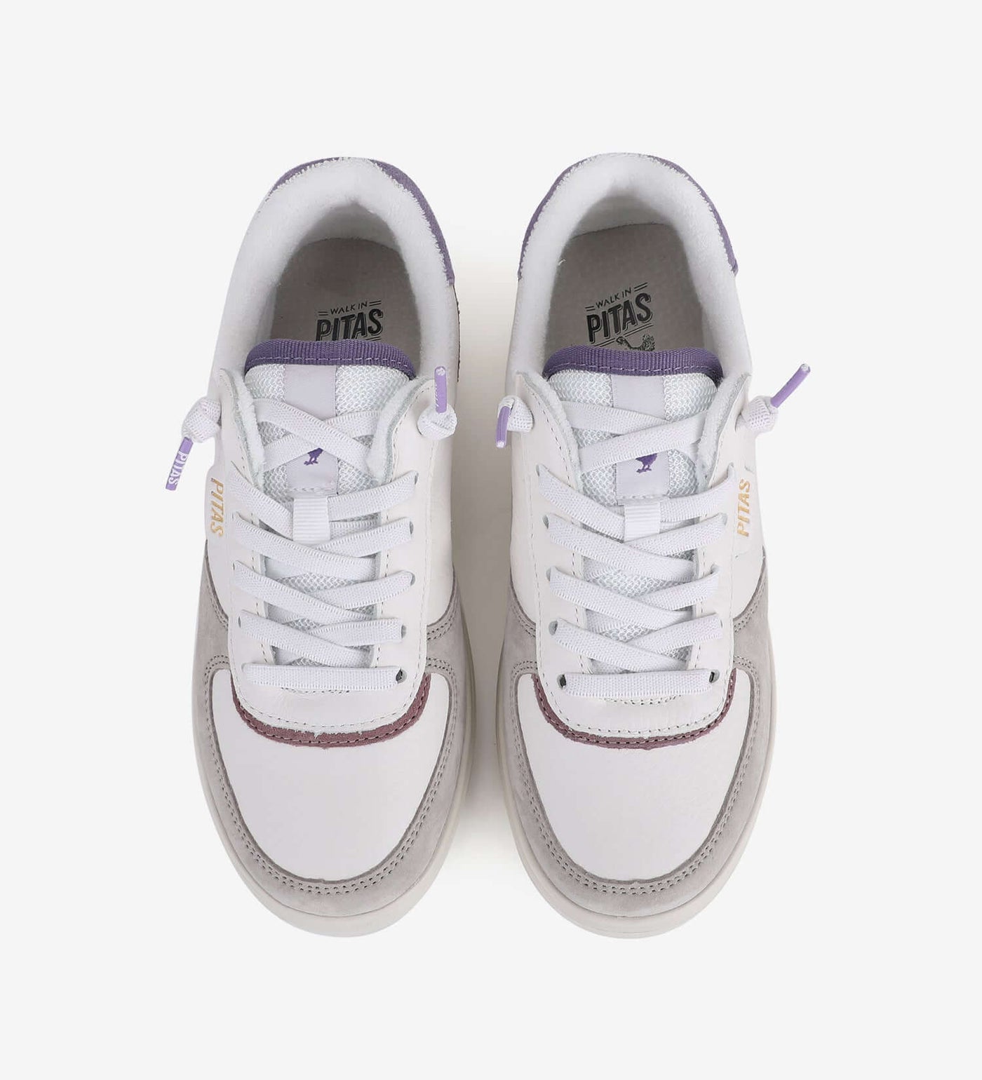 Zan Leather Sneakers by Pitas - top view of water-repellent, lightweight white sneakers with purple accents and easy-on elastic laces.