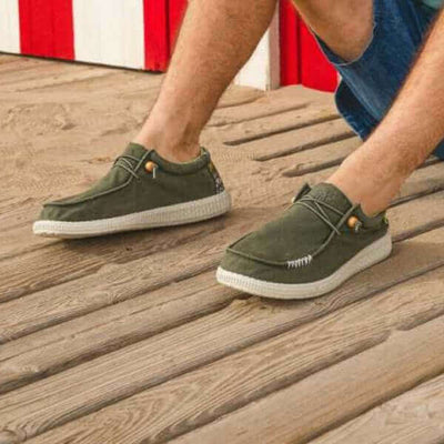 Person wearing WP150 Kin Ultralight Wally shoes with Aztec heel design, showcasing their comfortable and lightweight cotton build.